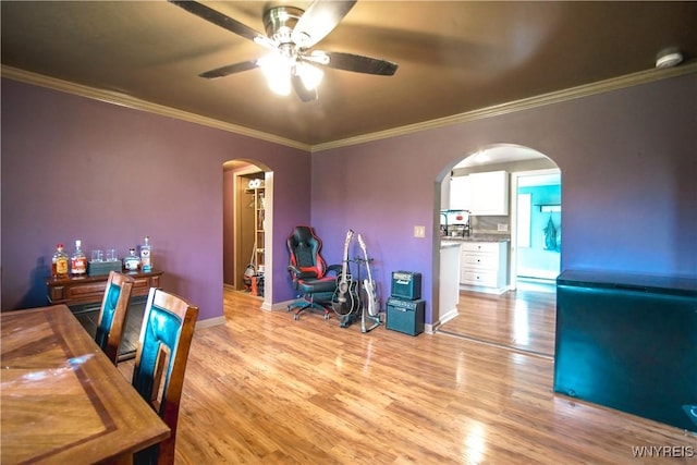 1934 E Middle Rd, Sheridan, NY 14136 - home office featuring arched walkways, a ceiling fan, ornamental molding, light wood finished floors, and baseboards