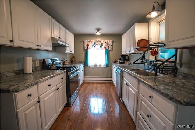 1934 E Middle Rd, Sheridan, NY 14136 - kitchen featuring appliances with stainless steel finishes, under cabinet range hood, dark wood-style floors, white cabinetry, and baseboard heating