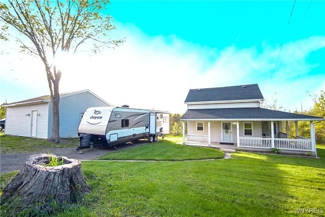 1934 E Middle Rd, Sheridan, NY 14136 - back of house with a porch, a yard, roof with shingles, and a fire pit