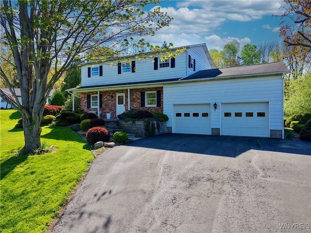 1604 Stardust Ln, Olean-City, NY 14760 - view of front facade featuring an attached garage, asphalt driveway, and a front yard