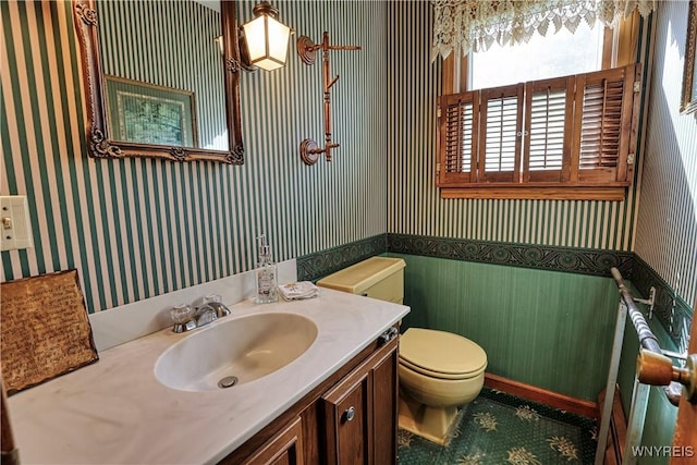 1604 Stardust Ln, Olean-City, NY 14760 - half bath with wallpapered walls, toilet, vanity, and wainscoting