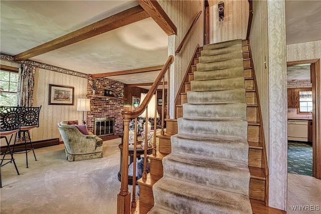1604 Stardust Ln, Olean-City, NY 14760 - staircase featuring wallpapered walls, carpet flooring, beamed ceiling, and a fireplace
