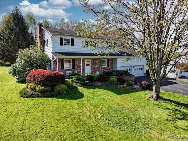1604 Stardust Ln, Olean-City, NY 14760 - traditional-style home with a chimney, driveway, an attached garage, and a front yard