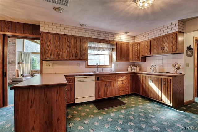 1604 Stardust Ln, Olean-City, NY 14760 - kitchen featuring white appliances, carpet, a sink, a peninsula, and brown cabinets