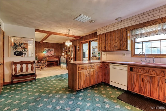1604 Stardust Ln, Olean-City, NY 14760 - kitchen featuring dishwasher, carpet floors, a sink, a peninsula, and brown cabinetry