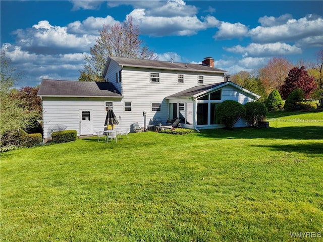 1604 Stardust Ln, Olean-City, NY 14760 - back of property with a lawn, a sunroom, and a chimney