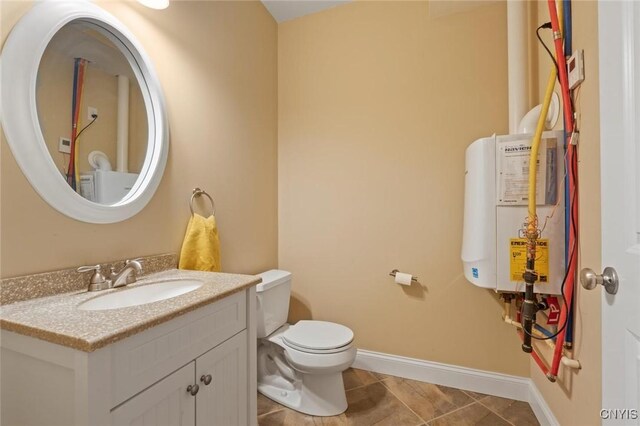 3543 Lost Hollow Rd, Skaneateles, NY 13152 - half bathroom with water heater, vanity, toilet, baseboards, and tile patterned flooring