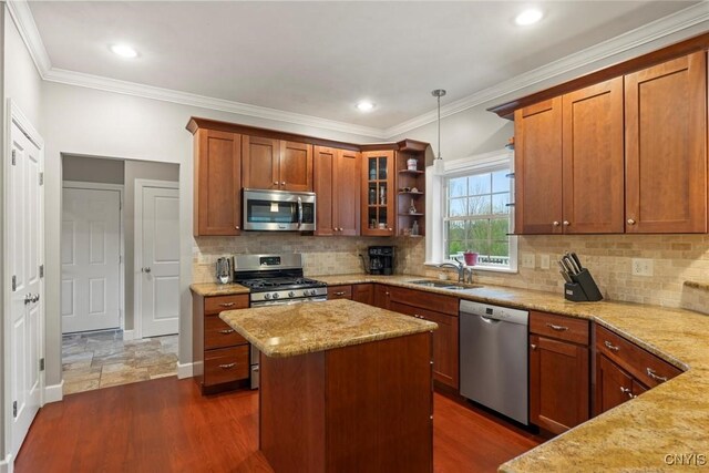 3543 Lost Hollow Rd, Skaneateles, NY 13152 - kitchen featuring stainless steel appliances, a sink, light stone counters, a kitchen island, and backsplash