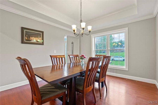 3543 Lost Hollow Rd, Skaneateles, NY 13152 - dining room featuring baseboards, a chandelier, wood finished floors, and crown molding