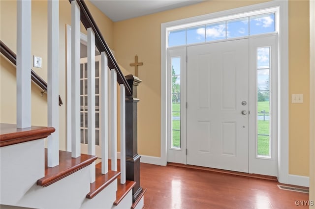 3543 Lost Hollow Rd, Skaneateles, NY 13152 - entrance foyer featuring stairs, wood finished floors, and baseboards
