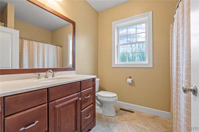 3543 Lost Hollow Rd, Skaneateles, NY 13152 - bathroom with vanity, toilet, tile patterned floors, and baseboards