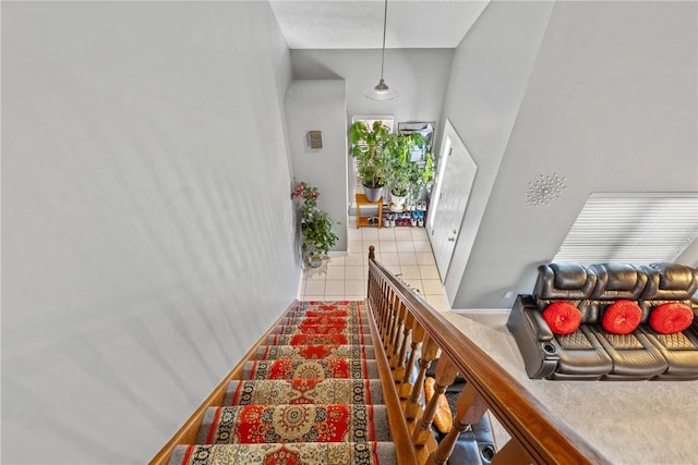 staircase with tile patterned floors