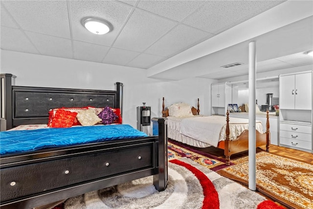 bedroom featuring a paneled ceiling