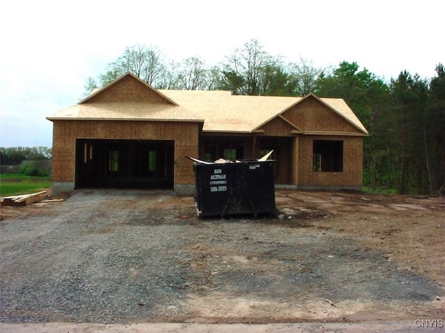 4547 Hollyshire Way, Clay, NY 13041 - unfinished property featuring an attached garage and dirt driveway