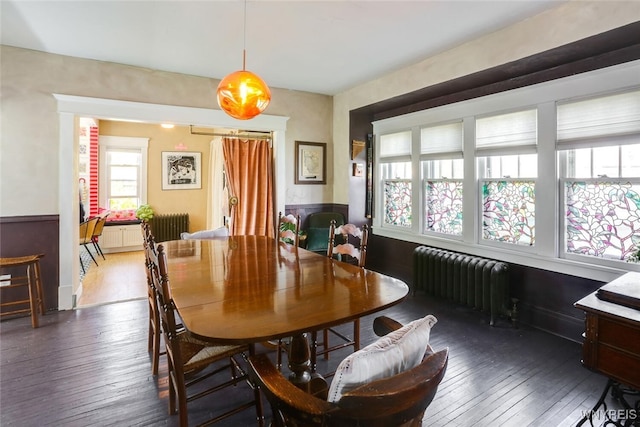 82 Radcliffe Rd, Buffalo, NY 14214 - dining area featuring radiator heating unit and hardwood / wood-style flooring