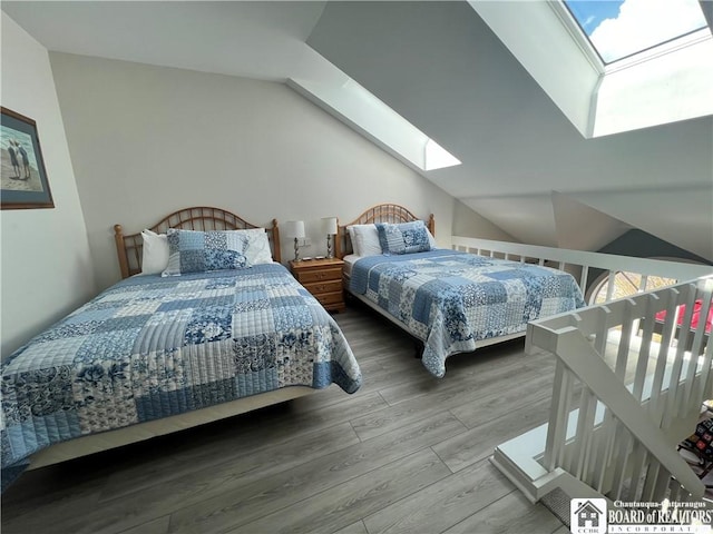 1 Pratt Ave Unit 407, Chautauqua, NY 14722 - bedroom featuring a skylight, wood finished floors, and lofted ceiling