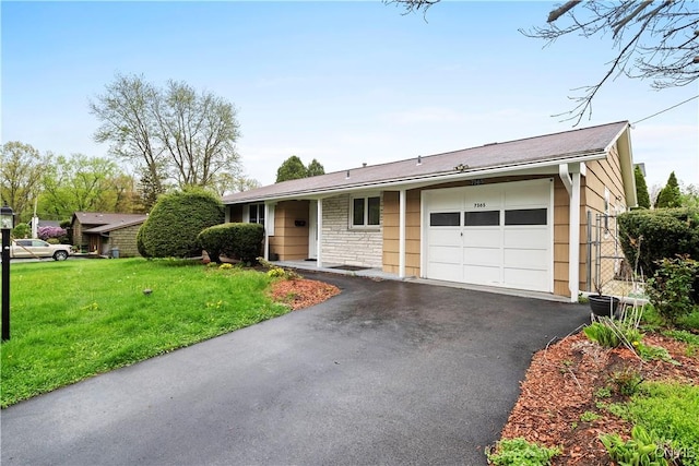 7565 Audrey Dr, Clay, NY 13212 - single story home featuring a garage, a front yard, driveway, and stone siding