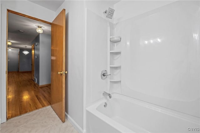 7565 Audrey Dr, Clay, NY 13212 - full bath featuring baseboards and shower / tub combination