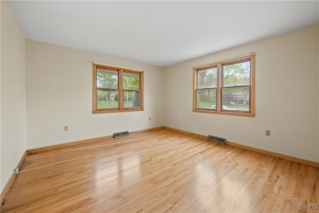 7565 Audrey Dr, Clay, NY 13212 - unfurnished room with wood finished floors and baseboards