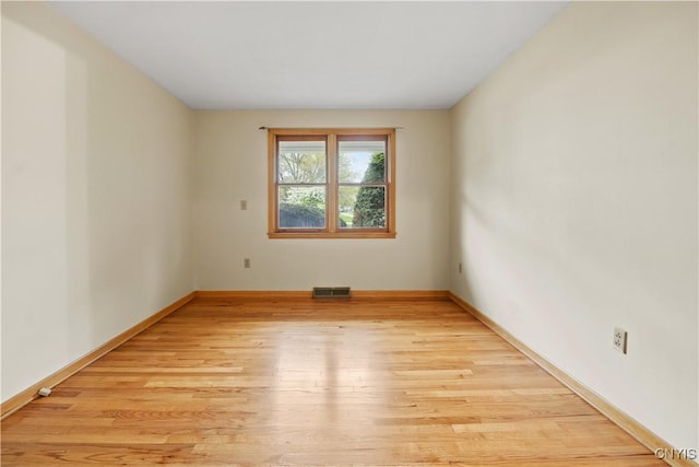 7565 Audrey Dr, Clay, NY 13212 - spare room featuring light wood-type flooring and baseboards