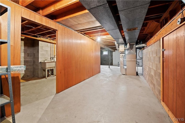 7565 Audrey Dr, Clay, NY 13212 - unfinished basement featuring heating unit and a sink