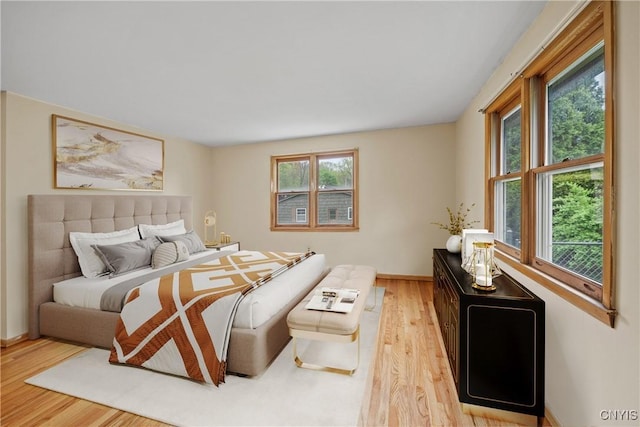 7565 Audrey Dr, Clay, NY 13212 - bedroom featuring light wood finished floors and baseboards