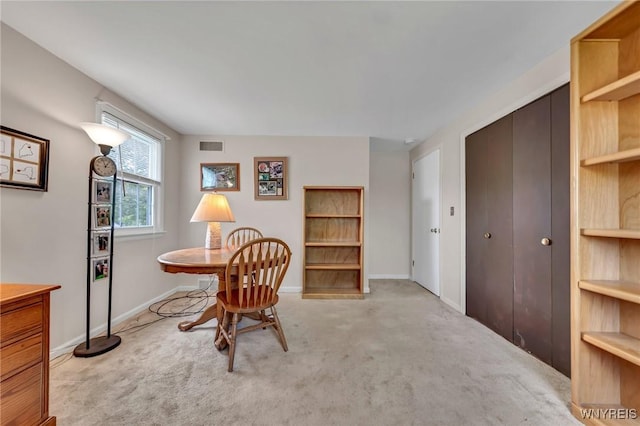 living area featuring carpet flooring and baseboards