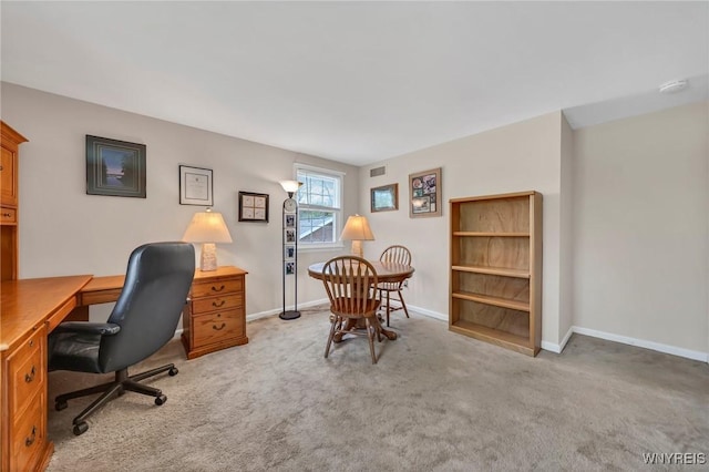 office featuring light carpet and baseboards