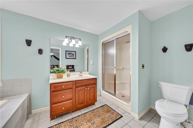 full bath with a shower stall, toilet, vanity, tile patterned floors, and baseboards