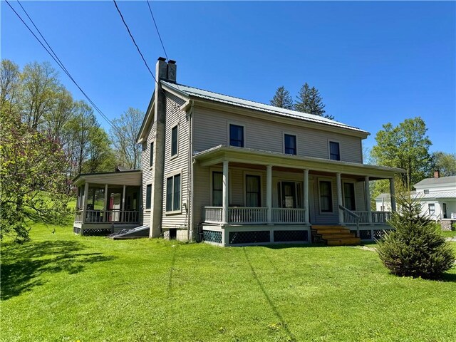 2395 State Highway 205, Laurens, NY 13810 - rear view of property featuring a chimney, a porch, a yard, and a sunroom