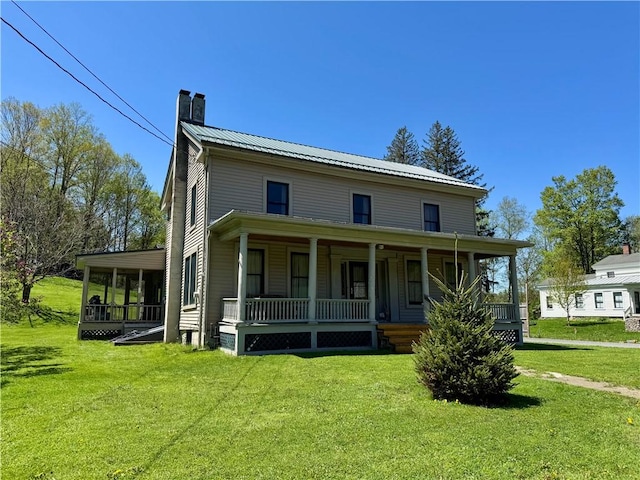 2395 State Highway 205, Laurens, NY 13810 - farmhouse inspired home with a chimney, metal roof, a front lawn, and covered porch