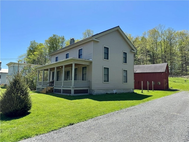2395 State Highway 205, Laurens, NY 13810 - view of property exterior featuring covered porch, a yard, and a chimney