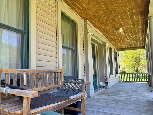 2395 State Highway 205, Laurens, NY 13810 - wooden deck with covered porch