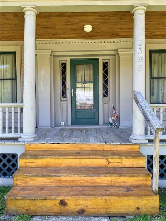 2395 State Highway 205, Laurens, NY 13810 - doorway to property with a porch and stucco siding