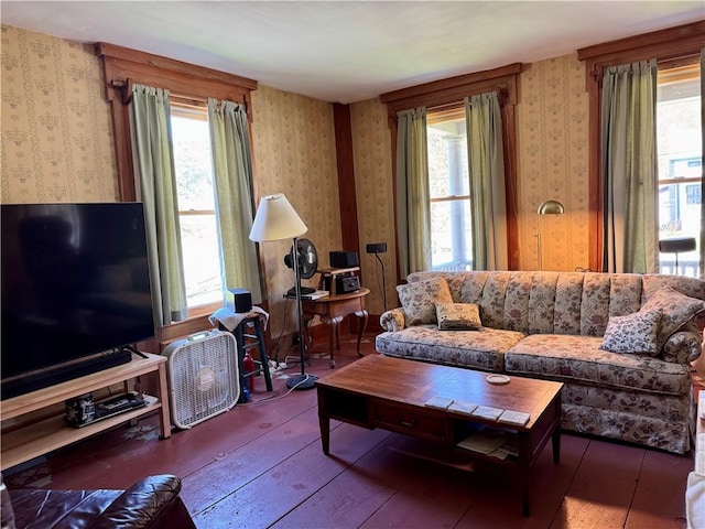 2395 State Highway 205, Laurens, NY 13810 - living area featuring wallpapered walls, wood-type flooring, and plenty of natural light