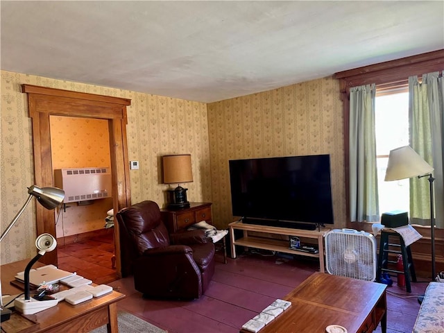 2395 State Highway 205, Laurens, NY 13810 - living area featuring wallpapered walls, hardwood / wood-style floors, and heating unit