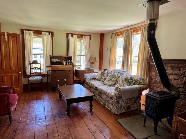 2395 State Highway 205, Laurens, NY 13810 - living area featuring a wood stove and hardwood / wood-style flooring