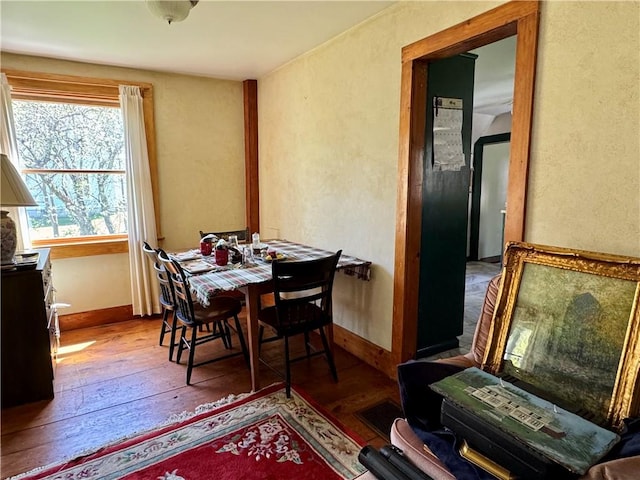 2395 State Highway 205, Laurens, NY 13810 - dining space featuring wood-type flooring, baseboards, and a textured wall