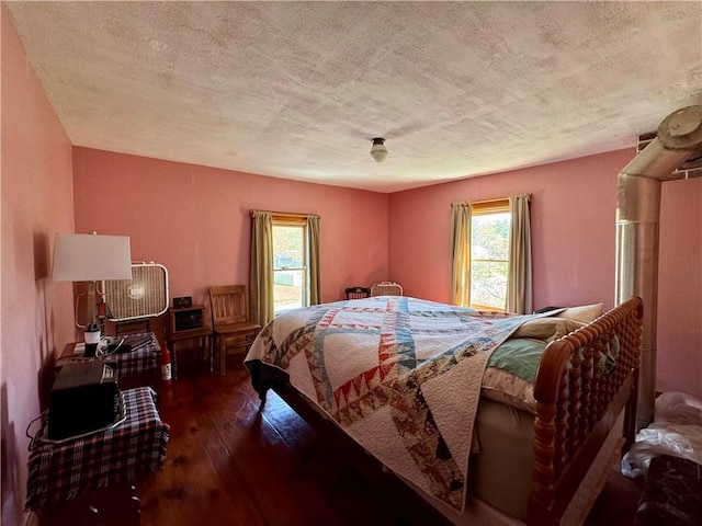 2395 State Highway 205, Laurens, NY 13810 - bedroom with a textured ceiling and hardwood / wood-style floors