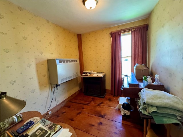 2395 State Highway 205, Laurens, NY 13810 - bedroom featuring heating unit, hardwood / wood-style floors, and wallpapered walls