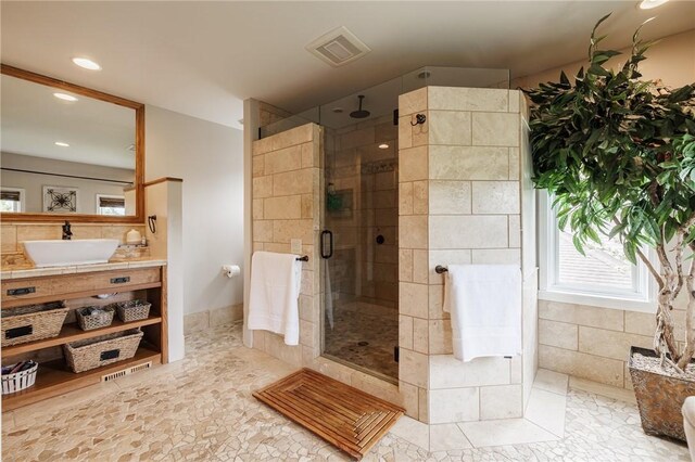bathroom featuring a shower stall, recessed lighting, and vanity