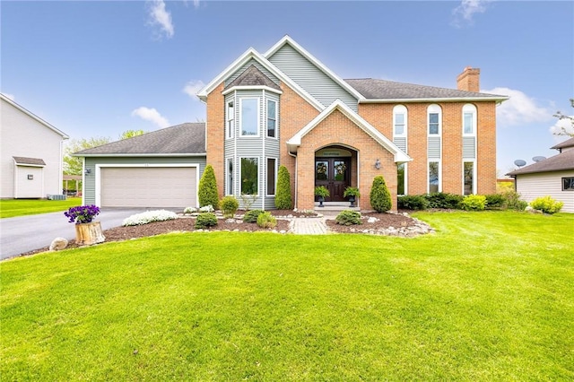 view of front of home with french doors, a chimney, and a front yard