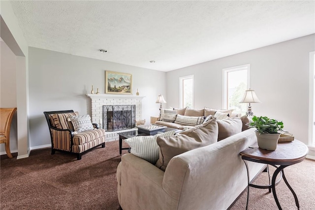 living area with dark carpet, a brick fireplace, baseboards, and a textured ceiling