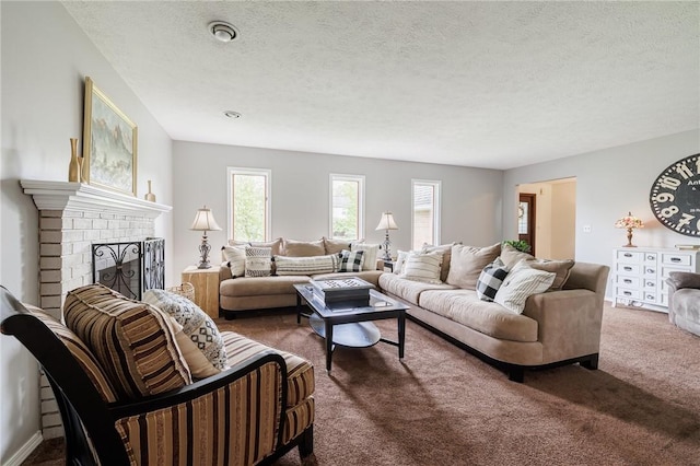 living room featuring dark colored carpet, a fireplace, and a textured ceiling