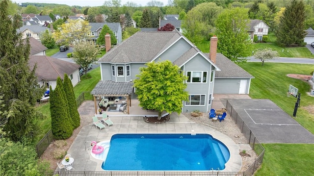 rear view of house with a chimney, a pergola, a patio, and a residential view