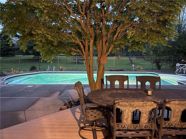 view of swimming pool featuring a fenced backyard and a patio area