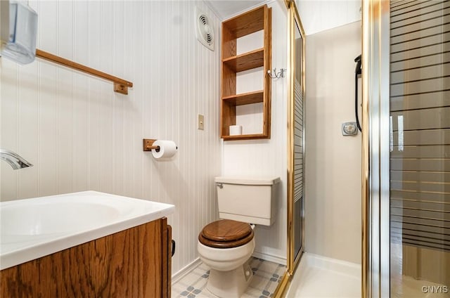 full bathroom with a shower stall, toilet, a sink, and tile patterned floors