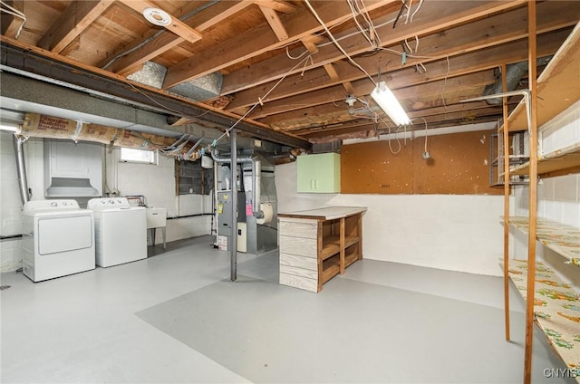 basement with washing machine and clothes dryer
