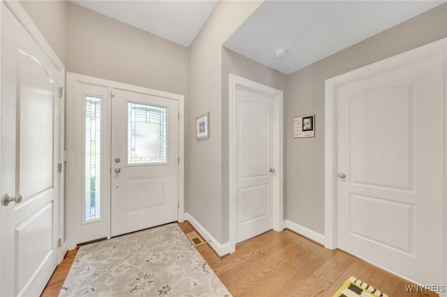 6811 Rivera Way, Clarence, NY 14051 - foyer entrance featuring light wood-style flooring and baseboards