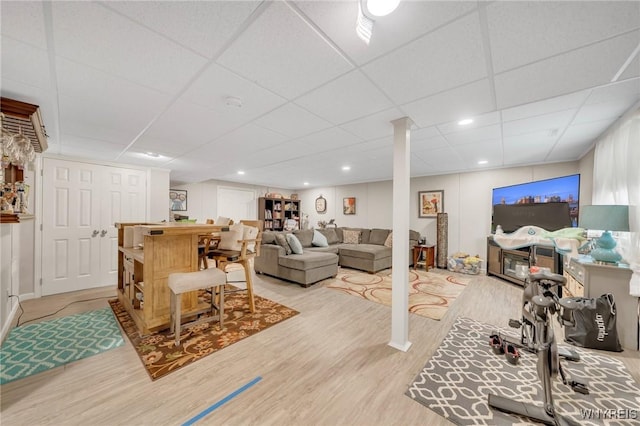 6811 Rivera Way, Clarence, NY 14051 - living area with a dry bar, wood finished floors, and a paneled ceiling